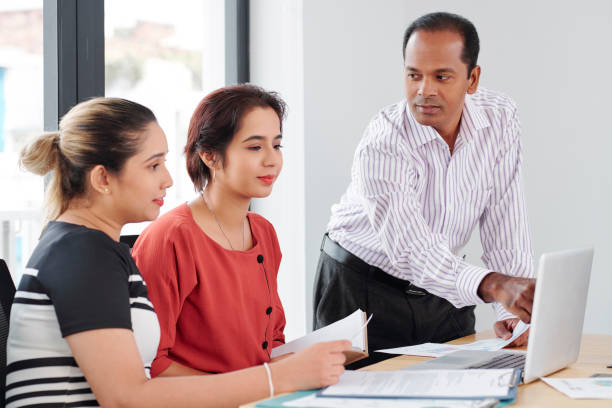 istock Business people working on laptop at office 1156686119