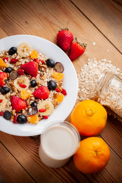 istock Healthy oats breakfast with various fruit toppings and soy milk. 1156690907