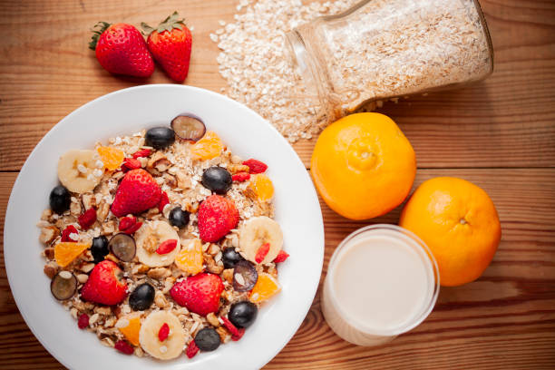 istock Healthy oats breakfast with various fruit toppings and soy milk. 1156690908