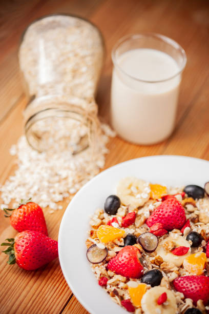 istock Healthy oats breakfast with various fruit toppings and soy milk. 1156691009