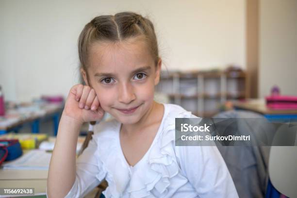 Elementary School Student In Classroom Stock Photo - Download Image Now - 6-7 Years, Apron, Cheerful