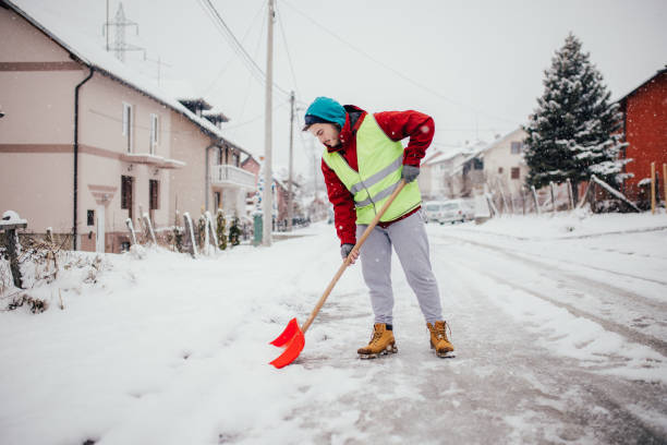 istock Man with snow shovel 1156693640