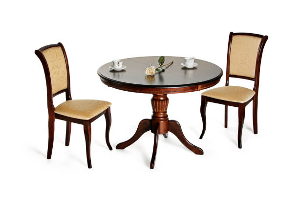 istock Two chairs and round table isolated on white with shadows 1156694325