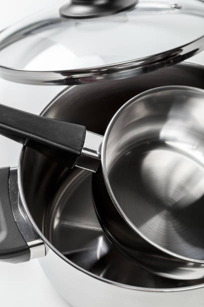 istock Stainless steel pots and pans isolated on white 1156695531