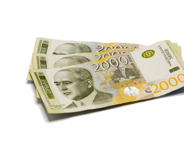 istock Three  banknotes worth 2000 Serbian Dinars with a portrait of a climate scientist Milutin Milankovic isolated on a white background 1156695934
