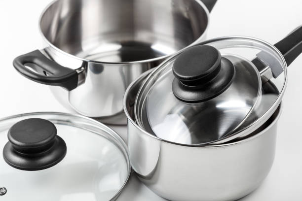 istock Stainless steel pots and pans isolated on white 1156697307