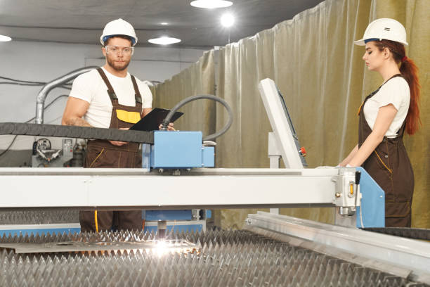 istock Two mechanics controlling process of plasma cutting 1156698026