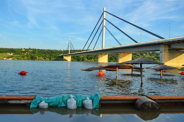 Bridge over Danube river flooded after the rains with sandbags protection, Novi Sad, Serbia