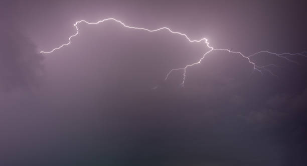 istock Lightning strike on the dark cloudy sky 1156699425