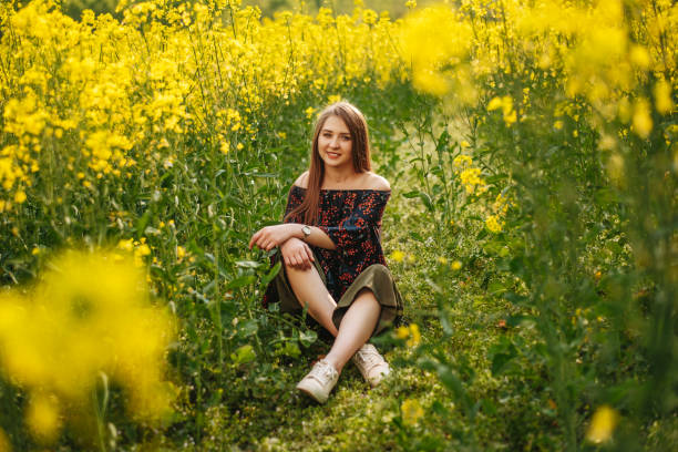 istock Young woman in the spring field 1156703845