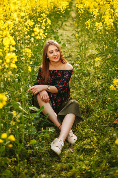 istock Young woman in the spring field 1156703953