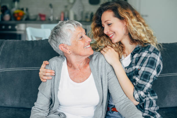 istock Daughter embracing her mother 1156710375