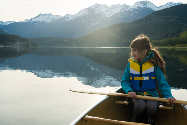 istock Girl experiencing nature in a canoe 1156711487