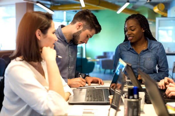istock Young coworkers in modern office 1156712042