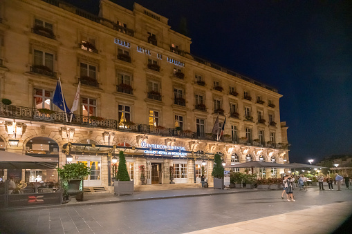 Bordeaux, France, July 2018 -The Entrance of the Grand Intercontinental Hotel de Bordeaux at night waiting for guests to arrive