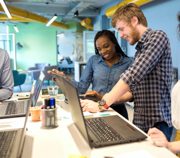 istock Young coworkers in modern office 1156712309