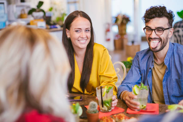 istock Young couple having fun with friends 1156712339