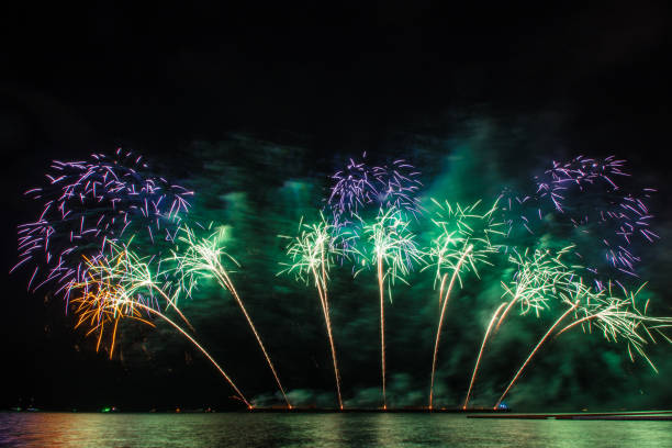 istock Beautiful firework display for celebration over the sea 1156712373
