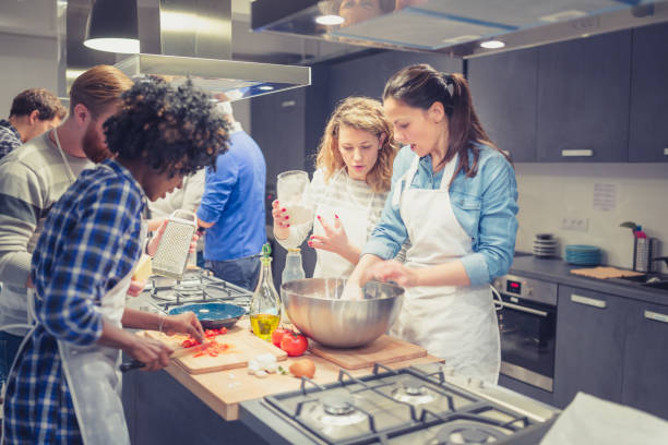 istock attendees of cooking class enjoying their time 1156713239