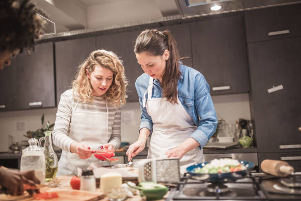 istock Cooking class participants having fun, enjoying their time 1156713296