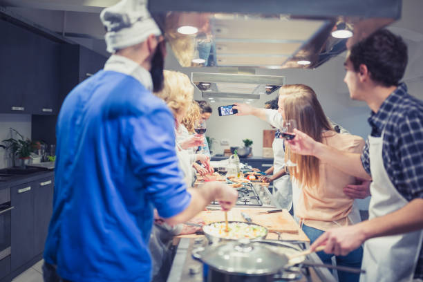 istock Chef is supervising attendees of cooking class while they are making meals. 1156713360