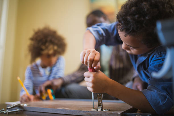 istock Father and his children doing some DIY work at home 1156715169
