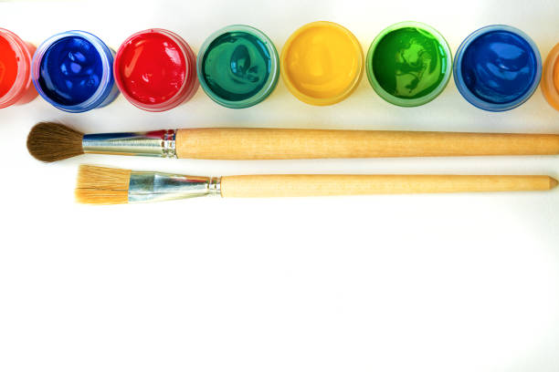 istock Creative background with art supplies on white background 1156716130
