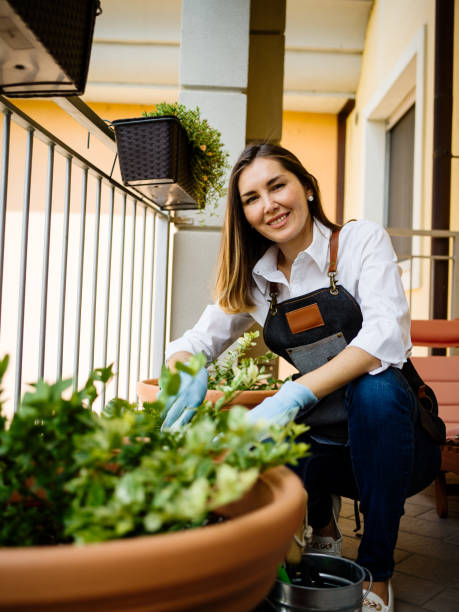 istock Young woman working on the balcony 1156716268
