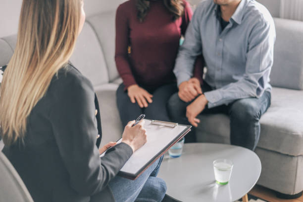 istock Home counselling with a young expecting couple with problems 1156717897