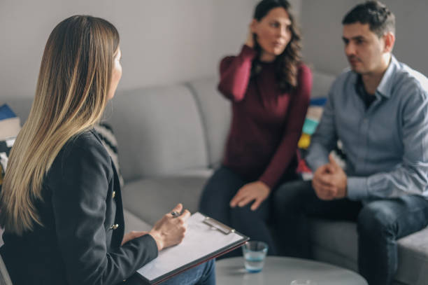 istock Home counselling with a young expecting couple with problems 1156717924
