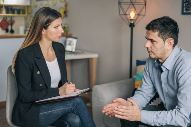 istock Meeting with counsellor at home 1156717929