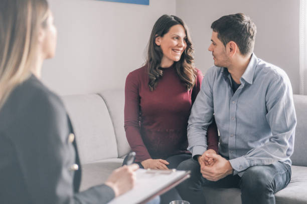 istock Happy couple expecting on counselling appointment 1156717937