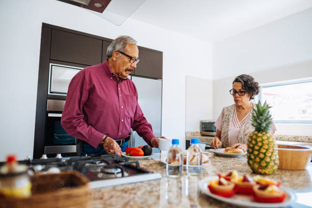istock Active senior couple having vegan breakfast at home. 1156718376