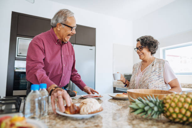 istock Adorable vital seniors eating breakfast 1156718378