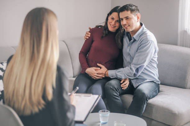 istock Happy couple expecting on counselling appointment 1156718382