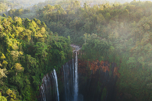 Scenic aerial view of Tumpak Sewu waterfall in the jungles on Java, Indonesia
