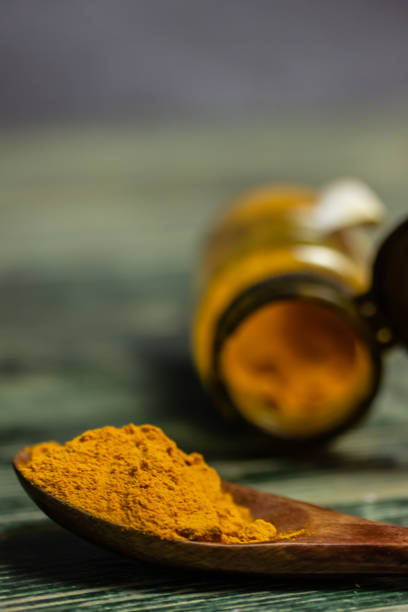 istock Dried curry powder in a spoon 1156721422