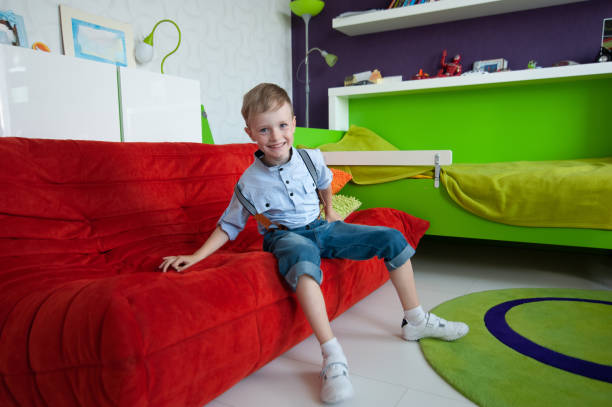 istock The boy is alone at home in his room. 1156723057