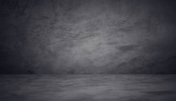 istock dark and black wall cement studio room background 1156723112