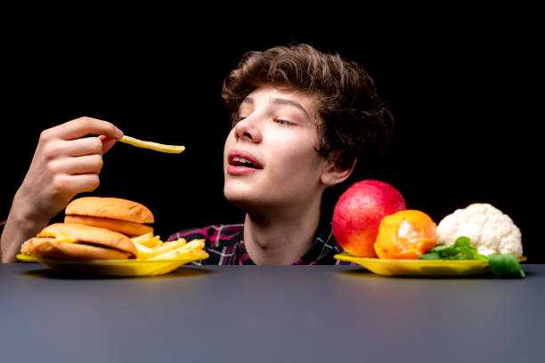 istock young male eat fried potato free with soda bb 1156723280