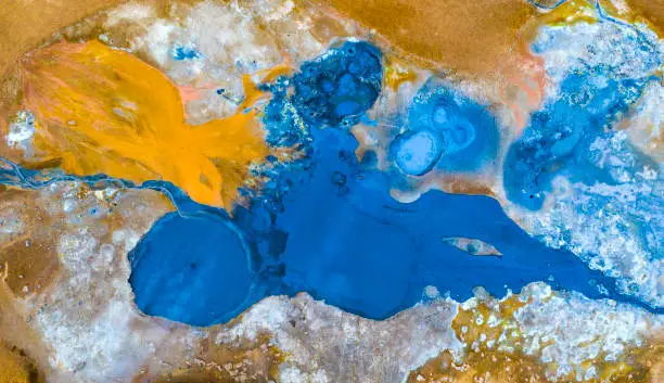 Aerial view of icelandic vulcanic sulfur subsoil. Geothermal coloured abstract background