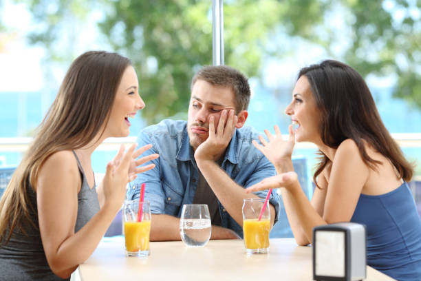 istock Bored man listening his friends conversation 1156732125