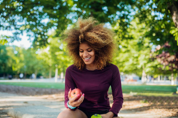 istock Fit woman holding an apple 1156733589