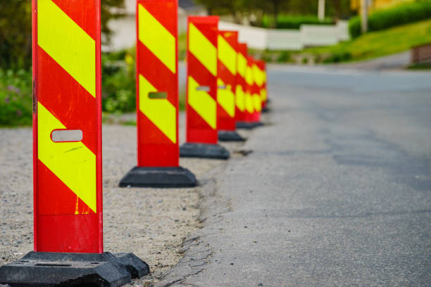 istock Yellow red road warning signs 1156733899