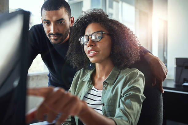 istock Two business colleagues working together in office 1156735745