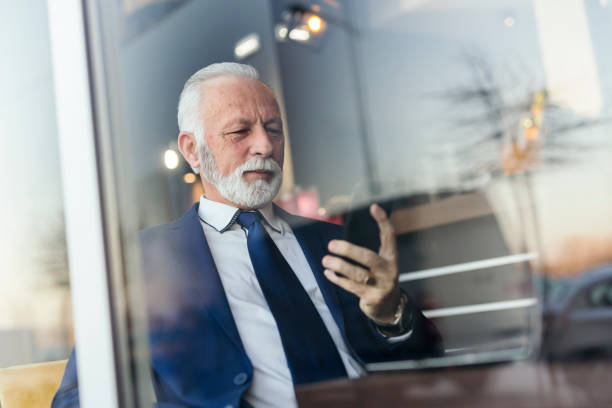 istock Senior businessman sending an email 1156738617