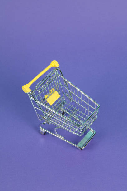 istock shopping cart on purple background 1156739924