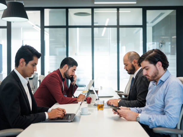 istock Concentrated businessmen hard at work 1156741422