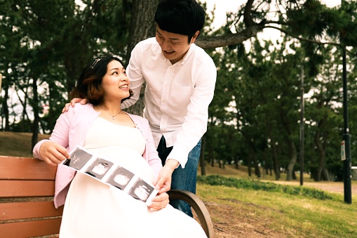 Japanese couple is looking ultrasound photo