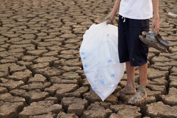 istock Asia volunteer and cleaning plastic around river, Plastic pollution and solution concept. 1156748792